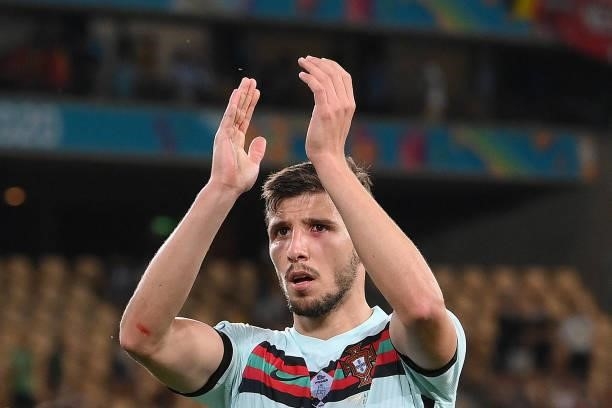 Portugal's defender Ruben Dias acknowledges fans at the end of the UEFA EURO 2020 round of 16 football match between Belgium and Portugal at La...