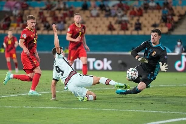 Belgium's goalkeeper Thibaut Courtois vies for the ball with Portugal's forward Andre Silva during the UEFA EURO 2020 round of 16 football match...