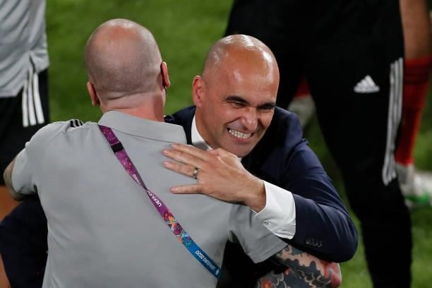 Belgium's Spanish coach Roberto Martinez celebrates the win in the UEFA EURO 2020 round of 16 football match between Belgium and Portugal at La...