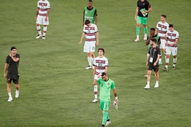 Portugal's players greet their supporters after the UEFA EURO 2020 round of 16 football match between Belgium and Portugal at La Cartuja Stadium in...