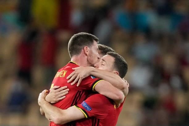 Belgium's players celebrate their win in the UEFA EURO 2020 round of 16 football match between Belgium and Portugal at La Cartuja Stadium in Seville...