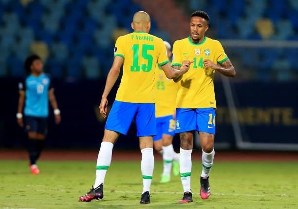 Eder Militao of Brazil celebrates with teammate Fabinho after scoring the first goal of his team during the match between Brazil and Ecuador as part...
