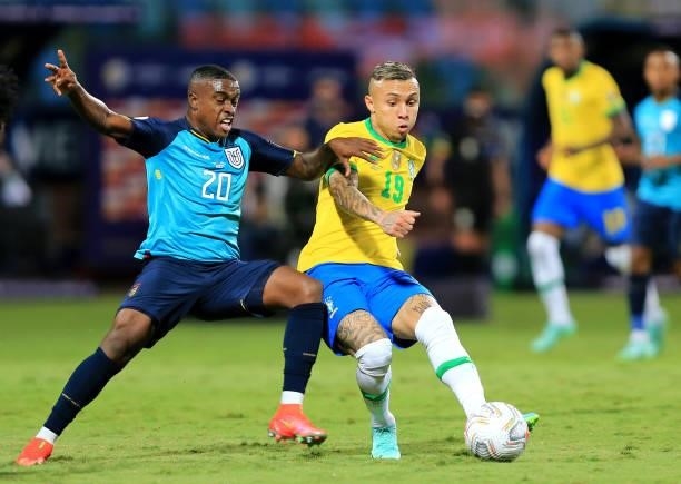 Everton of Brazil competes for the ball with Sebastian Mendez of Ecuador during the match between Brazil and Ecuador as part of Conmebol Copa America...