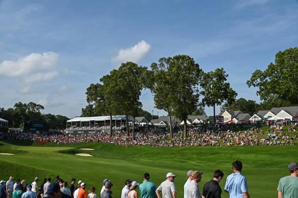 Fans watch play along the 18th hole during the final round of the Travelers Championship at TPC River Highlands on June 27, 2021 in Cromwell,...