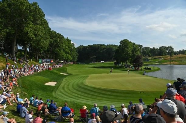 Fans watch play around the 15th green during the final round of the Travelers Championship at TPC River Highlands on June 27, 2021 in Cromwell,...