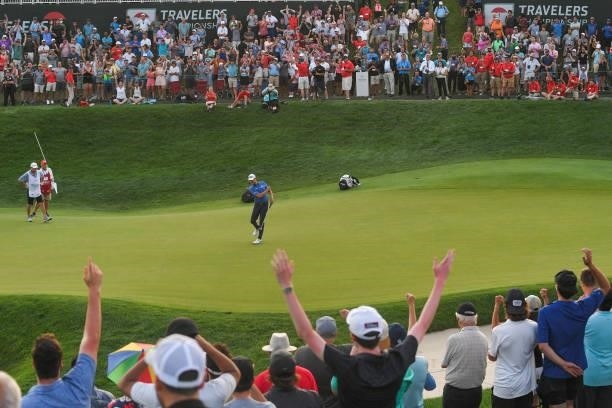 Harris English fist pumps while making the winning putt on the 18th green during the eighth playoff hole during the final round of the Travelers...