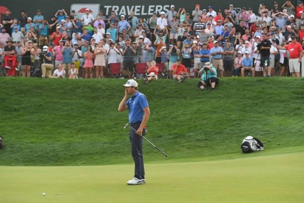 Harris English reacts to a missed putt on the 18th green during the sixth playoff hole during the final round of the Travelers Championship at TPC...