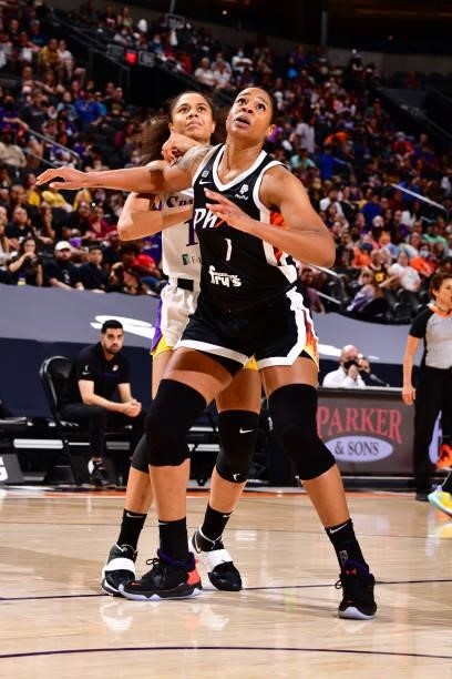 Nia Coffey of the Los Angeles Sparks fights for position with Kia Vaughn of the Phoenix Mercury looks on on June 27, 2021 at Phoenix Suns Arena in...
