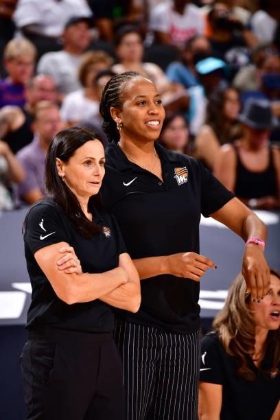 Coaches, Sandy Brondello and Chasity Melvin of the Phoenix Mercury smile during the game against the Los Angeles Sparks on June 27, 2021 at Phoenix...