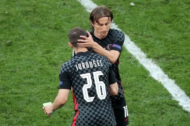 Luka Ivanusec of Croatia and Luka Modric of Croatia react during the UEFA Euro 2020 Championship Round of 16 match between Croatia and Spain at...