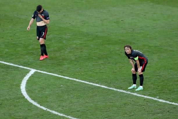 Josip Brekalo of Croatia and Luka Modric of Croatia react during the UEFA Euro 2020 Championship Round of 16 match between Croatia and Spain at...