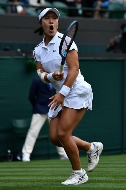 Player Kristie Ahn reacts after winning the second set against Britain's Heather Watson during their women's singles first round match of the 2021...