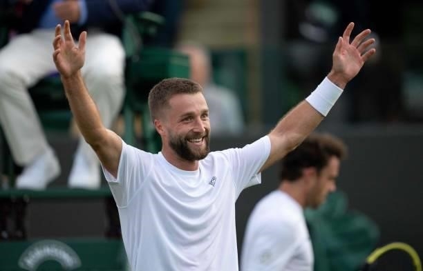 Britain's Liam Broady celebrates after defeating Italy's Marco Cecchinato on the first day of the 2021 Wimbledon Championships at the The All England...