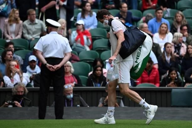 Britain's Andy Murray leaves the court at the end of the third set agianst Georgia's Nikoloz Basilashvili, while they close the roof of Centre Court,...