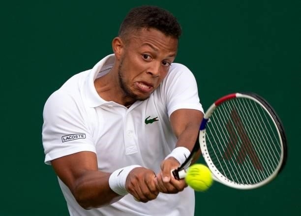 Britain's Jay Clarke returns against Belarus' Egor Gerasimov during their men's singles first round match on the first day of the 2021 Wimbledon...