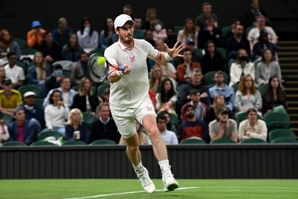 Britain's Andy Murray returns against Georgia's Nikoloz Basilashvili during their men's singles first round match on the first day of the 2021...
