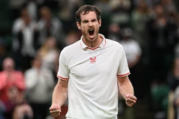 Britain's Andy Murray celebrates after beating Georgia's Nikoloz Basilashvili in their men's singles first round match on the first day of the 2021...