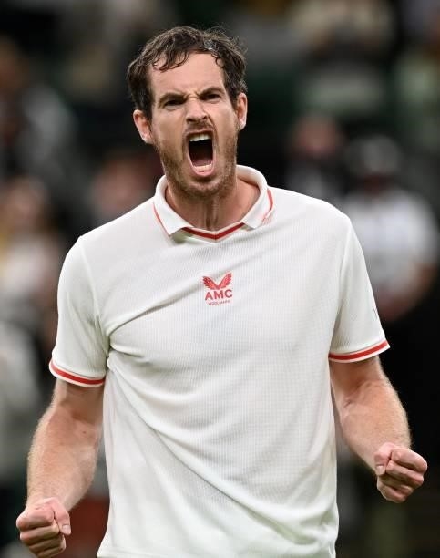 Britain's Andy Murray celebrates after beating Georgia's Nikoloz Basilashvili in their men's singles first round match on the first day of the 2021...