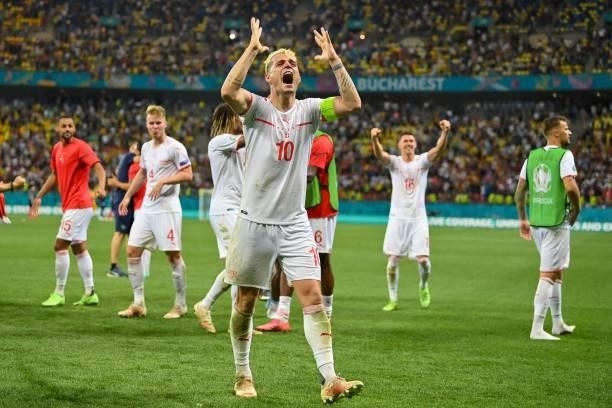 Switzerland's midfielder Granit Xhaka celebrates after winning the UEFA EURO 2020 round of 16 football match between France and Switzerland at the...
