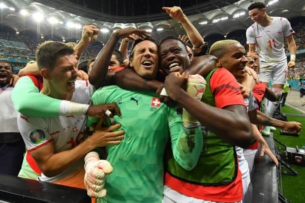 Switzerland's goalkeeper Yann Sommer and teammates celebrate their win in the UEFA EURO 2020 round of 16 football match between France and...