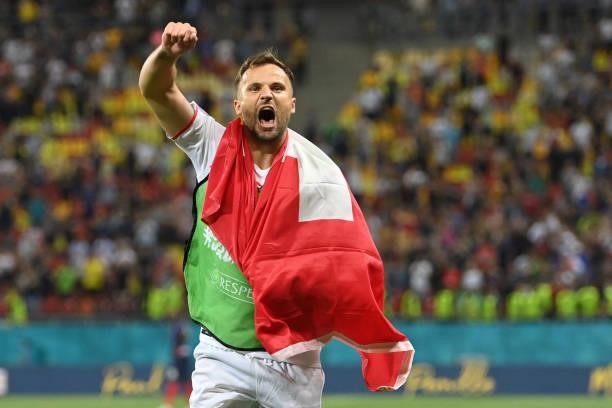 Switzerland's forward Haris Seferovic celebrates the team's win after the UEFA EURO 2020 round of 16 football match between France and Switzerland at...