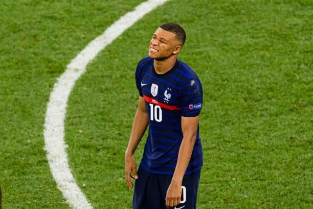 Kylian Mbappe of France reacts after missing a penalty shot during the UEFA Euro 2020 Championship Round of 16 match between France and Switzerland...
