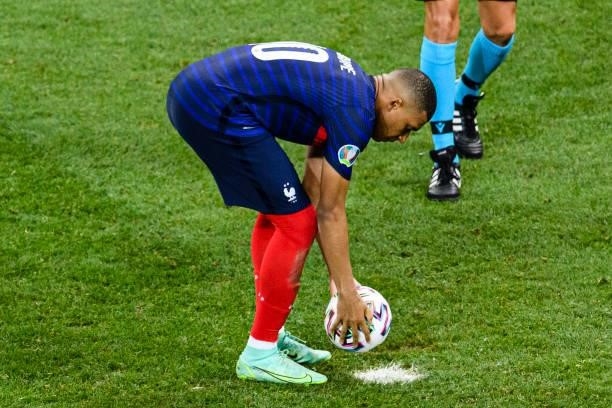 Kylian Mbappe of France sets up for his free kick during the UEFA Euro 2020 Championship Round of 16 match between France and Switzerland at National...