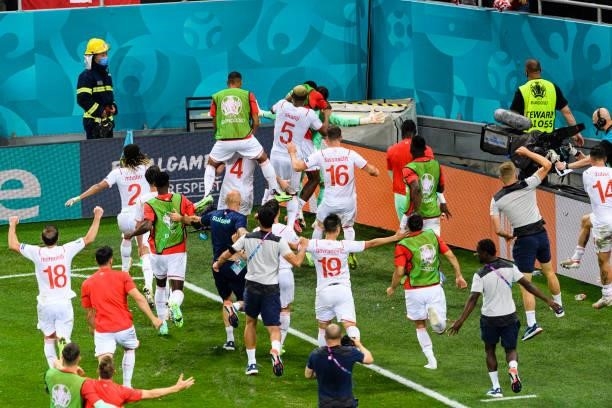 Switzerland players celebrate after defeating France during the UEFA Euro 2020 Championship Round of 16 match between France and Switzerland at...