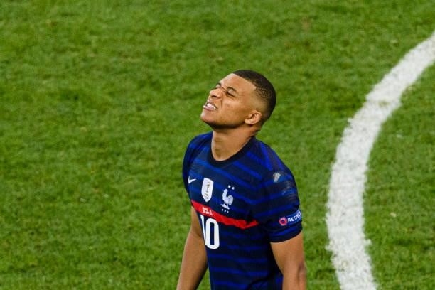 Kylian Mbappe of France reacts after missing a penalty shot during the UEFA Euro 2020 Championship Round of 16 match between France and Switzerland...