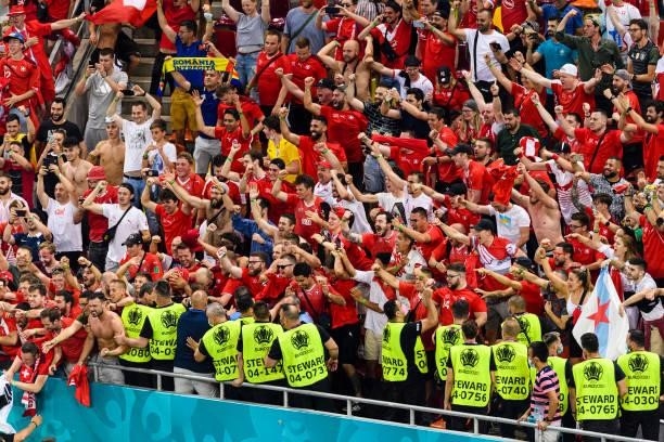 Switzerland supporters celebrate after defeating France during the UEFA Euro 2020 Championship Round of 16 match between France and Switzerland at...