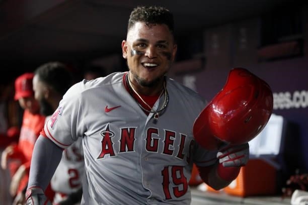 Juan Lagares of the Los Angeles Angels celebrates in the dugout after hitting a home run during the game between the Los Angeles Angels and the New...