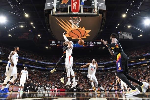 Jae Crowder of the Phoenix Suns passes the ball to Deandre Ayton of the Phoenix Suns during the game against the LA Clippers during Game 5 of the...