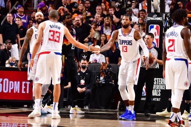 Nicolas Batum of the LA Clippers high fives Paul George of the LA Clippers during Game 5 of the Western Conference Finals of the 2021 NBA Playoffs on...