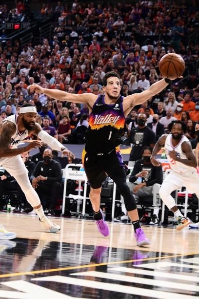 Devin Booker of the Phoenix Suns reaches for the ball during the game against the LA Clippers during Game 5 of the Western Conference Finals of the...