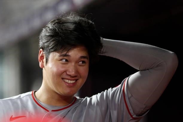Shohei Ohtani of the Los Angeles Angels looks on from the dugout during the game between the Los Angeles Angels and the New York Yankees at Yankee...
