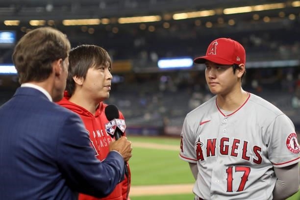 Shohei Ohtani of the Los Angeles Angels speaks with reporters after the Angels defeated the New York Yankees at Yankee Stadium on Monday, June 28,...