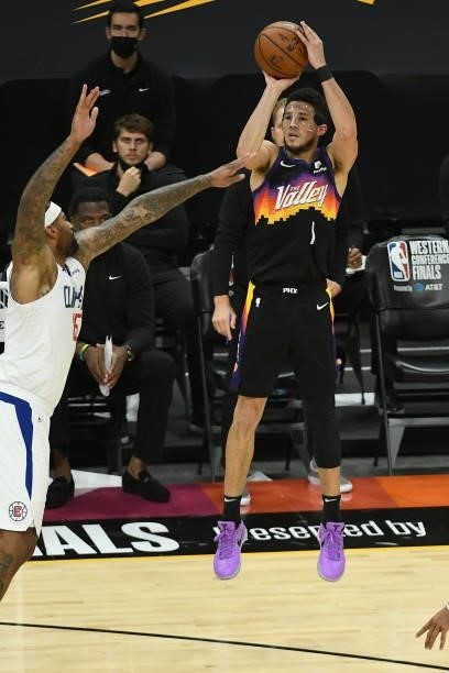 Devin Booker of the Phoenix Suns shoots a three point basket against the LA Clippers during Game 5 of the Western Conference Finals of the 2021 NBA...