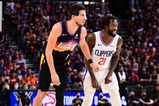 Devin Booker of the Phoenix Suns and Patrick Beverley of the LA Clippers look on during Game 5 of the Western Conference Finals of the 2021 NBA...