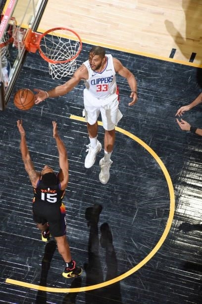 Cameron Payne of the Phoenix Suns and Nicolas Batum of the LA Clippers fight for the rebound during Game 5 of the Western Conference Finals of the...