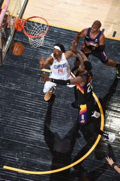 Terance Mann of the LA Clippers and Deandre Ayton of the Phoenix Suns fight for the rebound during Game 5 of the Western Conference Finals of the...