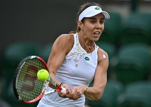 Romania's Mihaela Buzarnescu returns against US player Venus Williams during their women's singles first round match on the second day of the 2021...