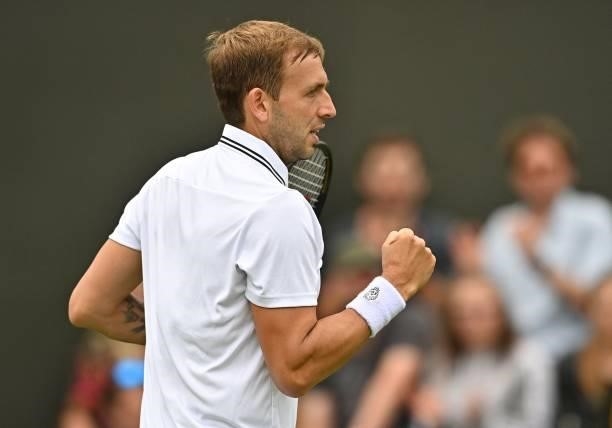 Britain's Daniel Evans celebrates a point against Spain's Feliciano Lopez during their men's singles first round match on the second day of the 2021...