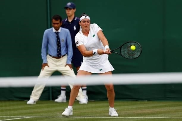 Tunisia's Ons Jabeur returns against Sweden's Rebecca Peterson during their women's singles first round match on the second day of the 2021 Wimbledon...