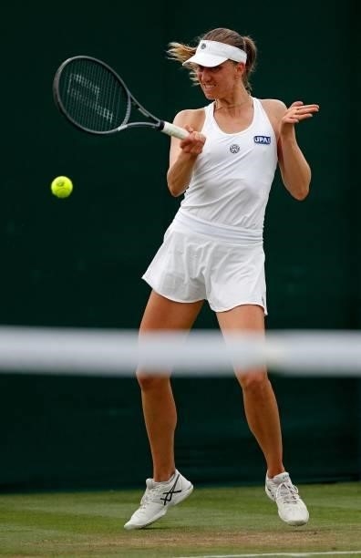 Germany's Mona Barthel returns against China's Lin Zhu during their women's singles first round match on the second day of the 2021 Wimbledon...