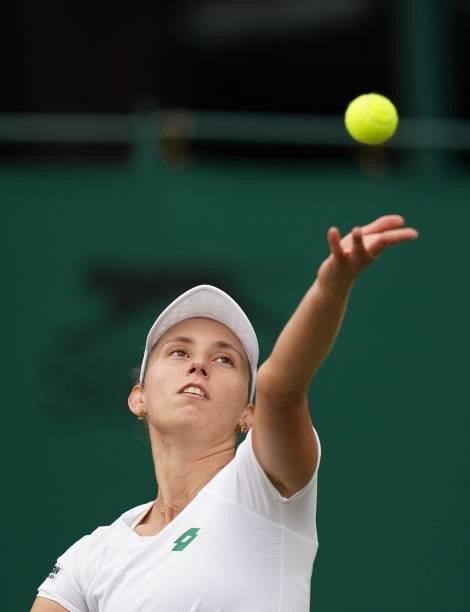 Belgium's Elise Mertens serves to Britain's Harriet Dart during their women's singles first round match on the second day of the 2021 Wimbledon...
