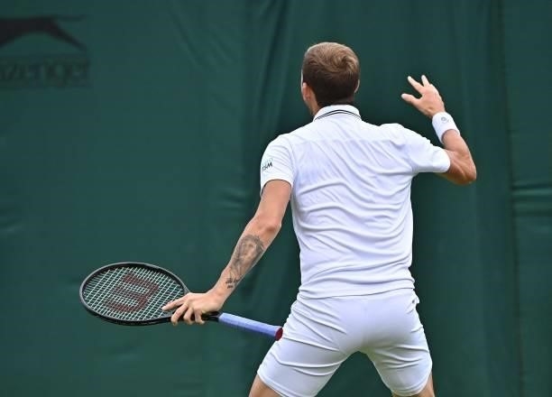 Britain's Daniel Evans celebrates his victory over Spain's Feliciano Lopez during their men's singles first round match on the second day of the 2021...