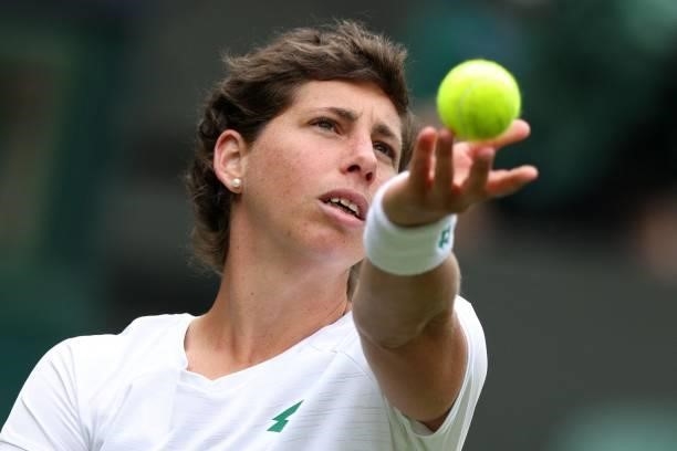 Spain's Carla Suarez Navarro throws the ball to serve against Australia's Ashleigh Barty during their women's singles first round match on the second...