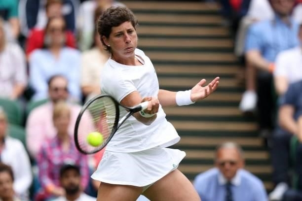 Spain's Carla Suarez Navarro returns against Australia's Ashleigh Barty during their women's singles first round match on the second day of the 2021...