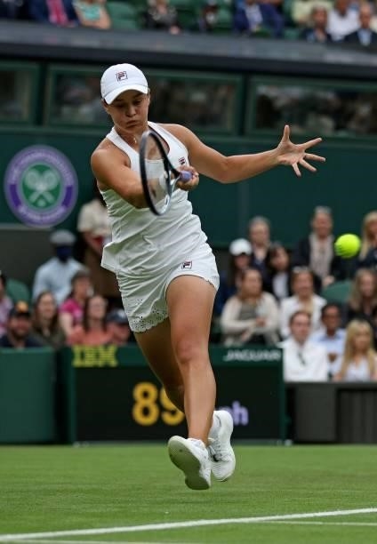 Australia's Ashleigh Barty returns against Spain's Carla Suarez Navarro during their women's singles first round match on the second day of the 2021...