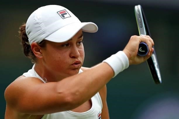 Australia's Ashleigh Barty returns against Spain's Carla Suarez Navarro during their women's singles first round match on the second day of the 2021...